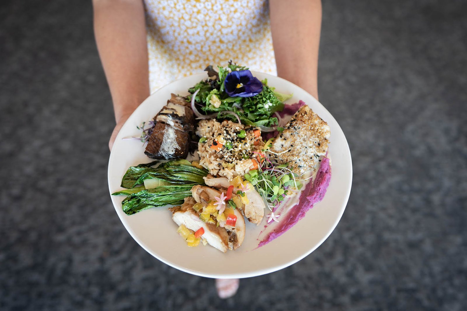 Home 30 A man holding a nicely designed food on a plate