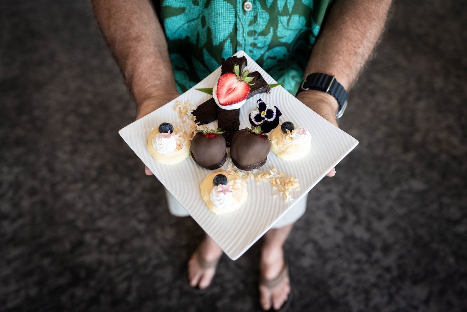 Home 29 A man holding a nicely designed food on a plate