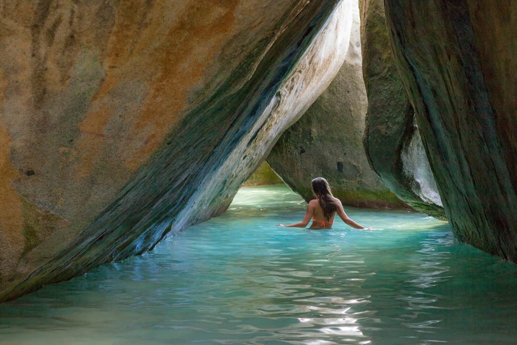 Woman Swimming In A Natural Rock Formation With Clear Turquoise Water, Cruz Bay Watersports.