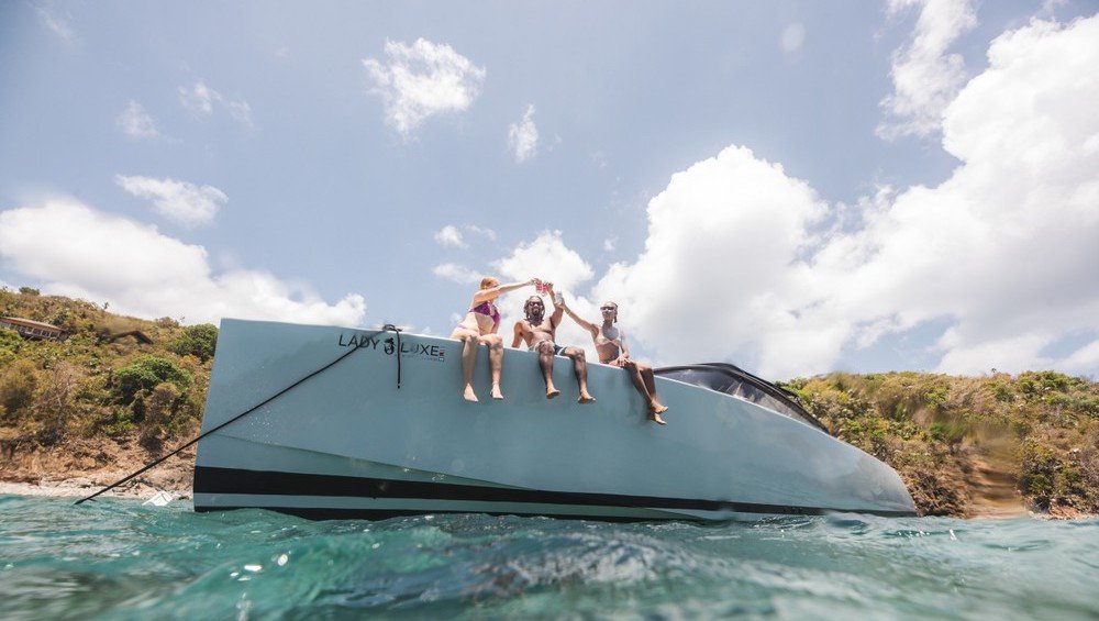 Group Enjoying On Vandutch Luxury Yacht Lady Luxe In Clear Coastal Waters