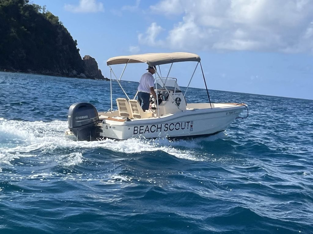 17' Scout boat labeled 'BEACH SCOUT,' likely available for rental in coastal waters.