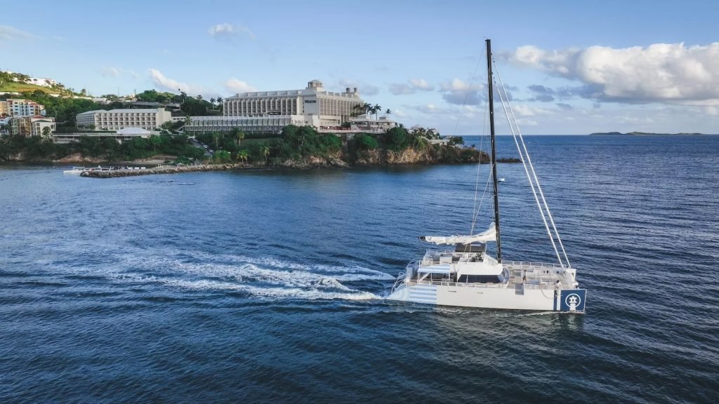 Catamaran Flying Frenchman sailing near Westin Frenchman's Reef, St. Thomas, US Virgin Islands.