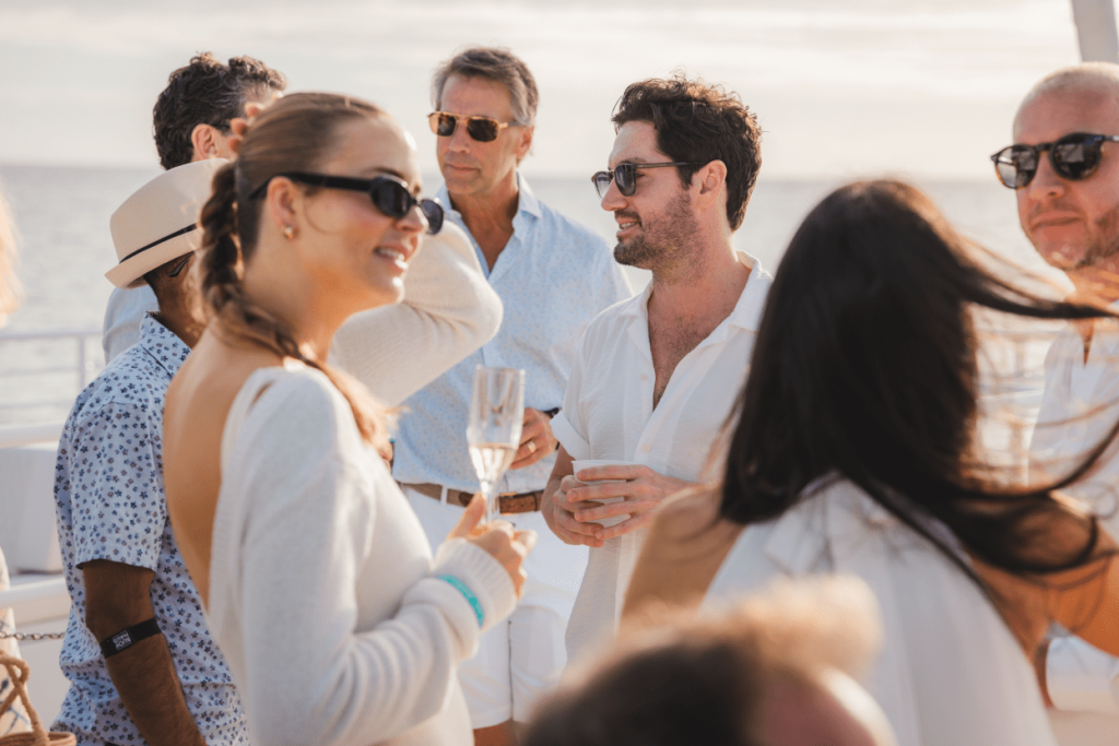 Group of people on a cruise enjoying activities and talking with each other.
